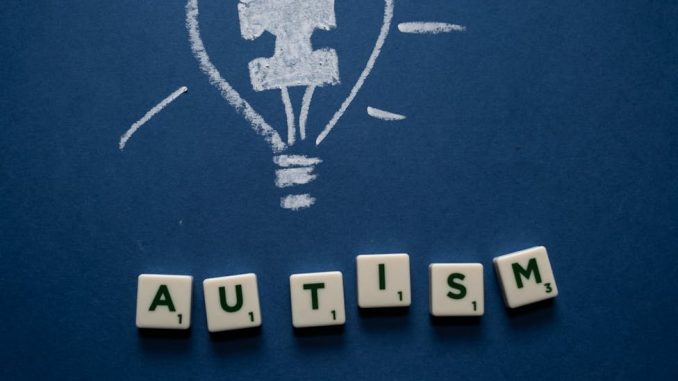 letter tiles and chalks on a blue surface