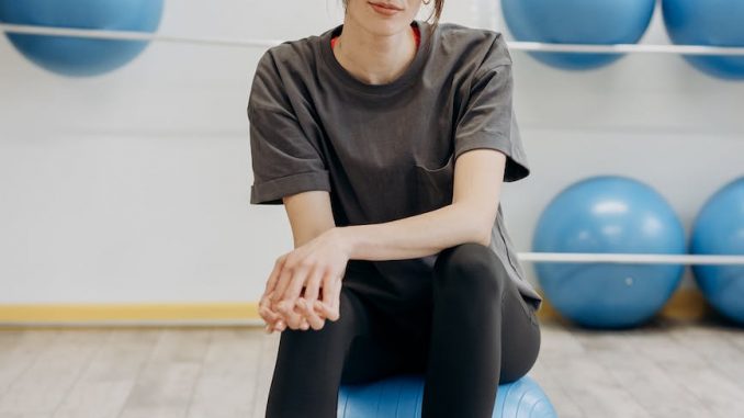woman sitting on a yoga ball