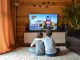 faceless little boys entertaining with tv at home