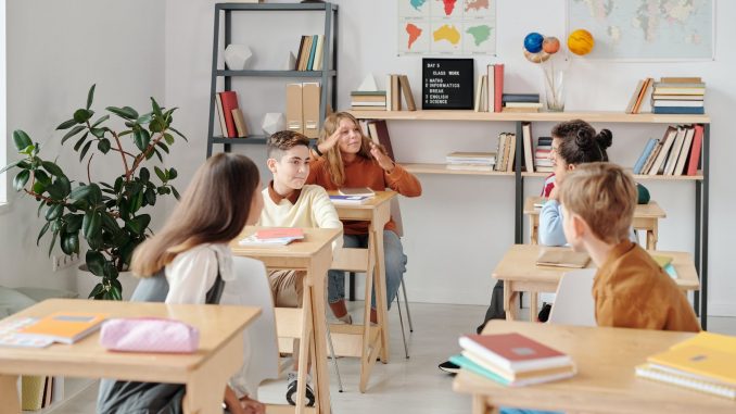 group of students sitting inside a classroom