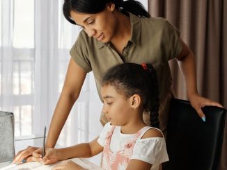 mother helping her daughter with homework