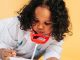 black female kid in doctor costume in studio