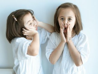 girl in white dress lying on bed